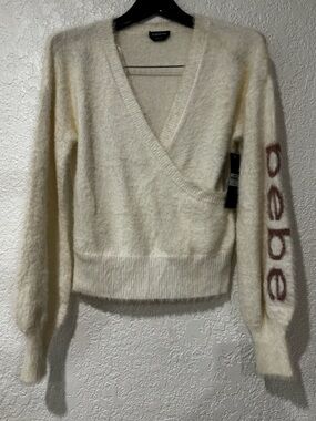 bebe Cream Fuzzy Wrap V-Neck Sweater with Logo Sleeve